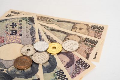 Japanese yen bills and coins. The Japanese economy has been sluggish for many years.