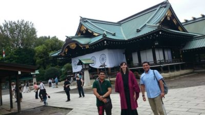 Tour customers in front of the controversial Yasukuni Shrine main hall in Tokyo, Japan