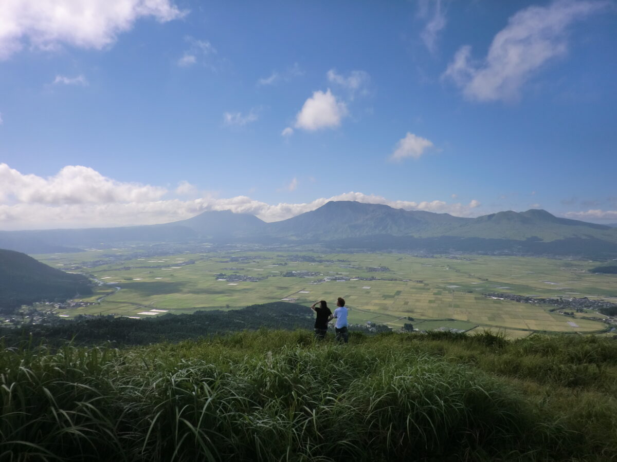 Caldera of Mount Aso from the grasslands of Daikanbo in Kumamoto, Kyushu, Japan. This picture is part of our travel guide.