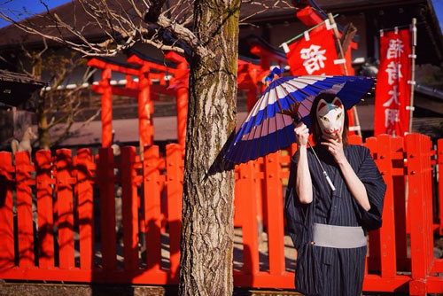 Man in kimono with a parasol in Edo Wonderland in Nikko, Japan