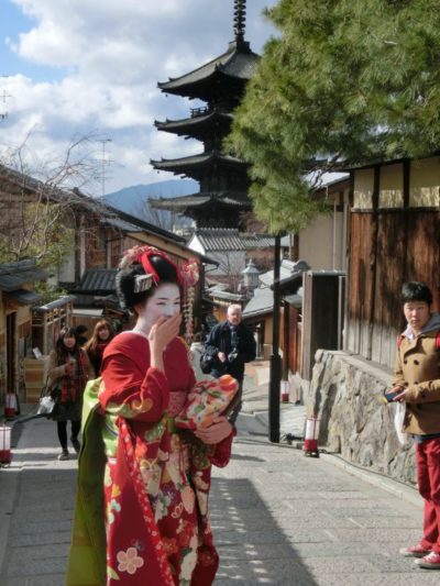 Maiko in front of a pagoda in Kyoto, Japan. Kyoto has a long history.