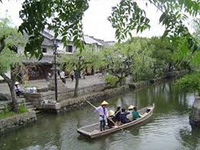Traditional boat in a canal in Kurashiki, Okayama, Japan