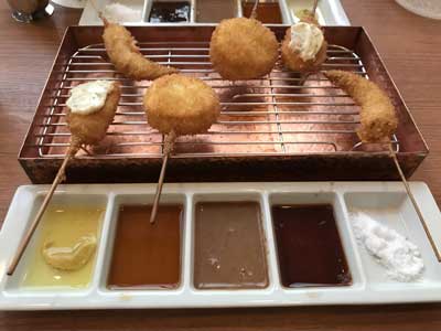 Kushiage with various sauces in Osaka, Japan