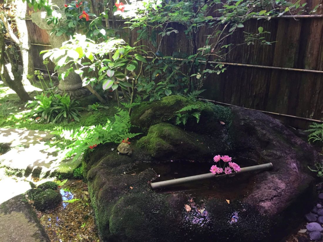 Water well in the garden of the Nomura samurai home in Kanazawa, Japan