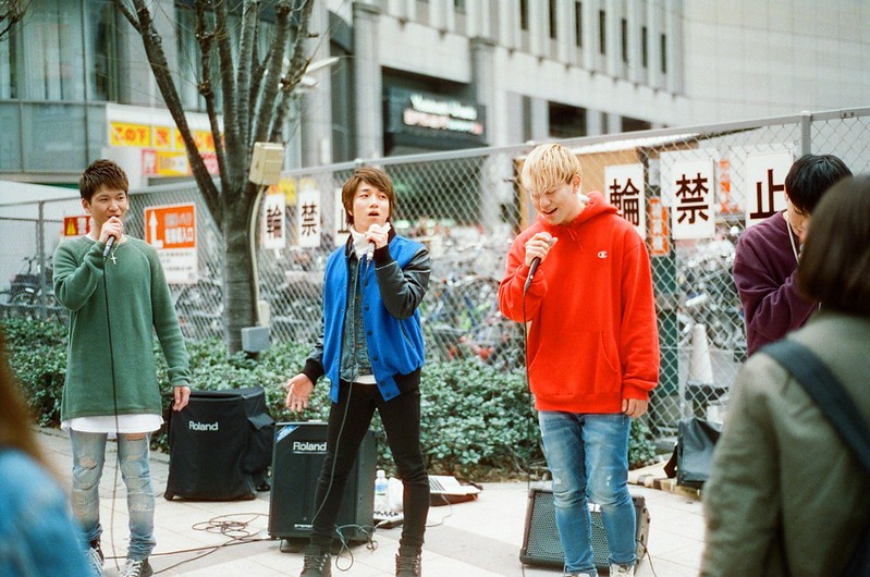 Young Japanese men busking in a city in Japan