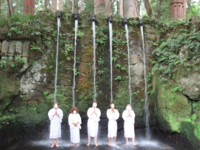 Waterfall meditation practice at Nissekiji Temple in Toyama, Japan