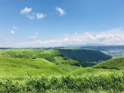 The green grass of Kusasenri Meadow in Mt. Aso, Japan