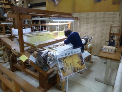 Artisan working in Nishijin Textile Center in Kyoto