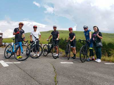 Cycling tour participants with bicycle near Mt Fuji