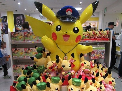 Pikachu as a station master in the Pokemon store of Tokyo Station