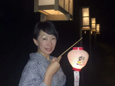 Japanese woman holding a lantern during the Nara Mantoe matsuri festival in the Todaiji, Nara, Japan